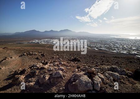 looking down over playa blanca from pathway up red montana roja extinct volcano near playa blanca Lanzarote Canary Islands Spain Stock Photo