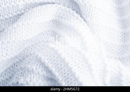 Gros plan sur fond blanc tricoté texturé. Banque D'Images