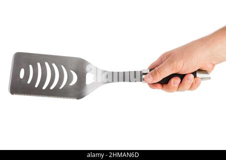 Une spatule de cuisson en métal argenté. Isolé sur un fond blanc. Gros plan. Banque D'Images