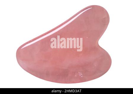 Pierre de quartz rose de Gua Sha naturelle isolée. Guasha outil de massage thérapie alternative pour améliorer la circulation. Massage du visage en pierre. Masque. Chines Banque D'Images