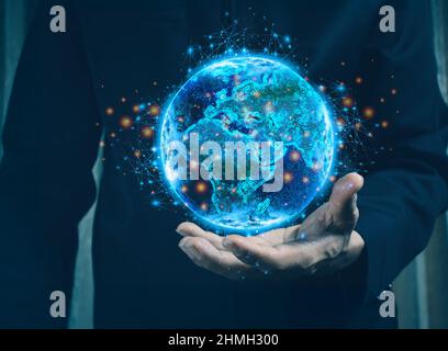 Homme d'affaires tenant le monde dans le creux de ses mains concept pour les affaires mondiales, la communicationspolitics ou la conservation de l'environnement. Banque D'Images