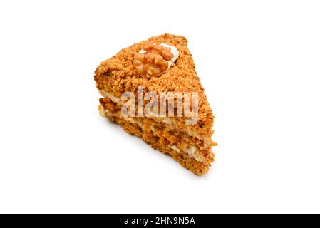 Paix de gâteau au miel isolé sur fond blanc. Banque D'Images