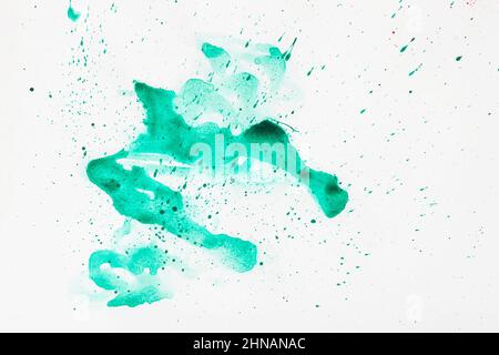 Arrière-plan abstrait peint à la main aquarelle, taches d'éclaboussures, breloques de couleur vert turquoise Banque D'Images