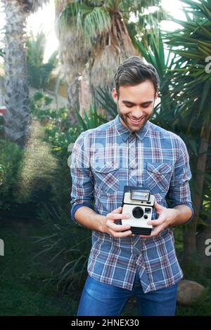 Il aime prendre des photos Banque D'Images