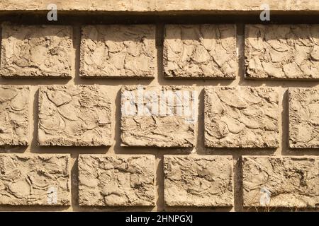 Arrière-plan de mur de briques anciennes. Mur de briques carrées. Texture de mur de pierre fissurée Banque D'Images