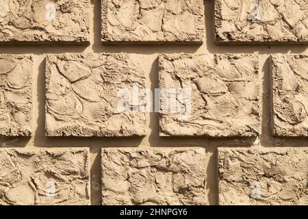 Arrière-plan de mur de briques anciennes. Mur de briques carrées. Texture de mur de pierre fissurée Banque D'Images