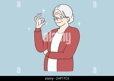OK bonne idée de geste de signe. Souriante âgée mûre grise femme debout montrant le signe ok avec les doigts sur la main regardant l'illustrateur de vecteur de caméra Banque D'Images