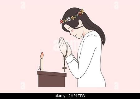 La religion croit en dieu et le concept de spiritualité. Jeune femme dans la couronne debout dans l'église ours bougie prier pour la santé tirant dans le geste religieux Banque D'Images