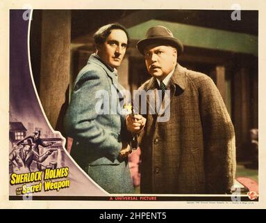 BASIL RATHBONE ET NIGEL BRUCE DANS SHERLOCK HOLMES ET L'ARME SECRÈTE (1942), DIRIGÉE PAR ROY WILLIAM NEILL. Crédit : PHOTOS / Album UNIVERSEL Banque D'Images