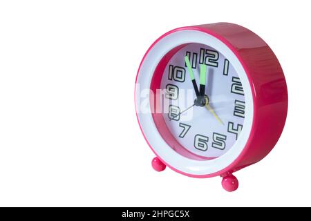 Horloge rose isolée sur fond blanc. Objet mécanique avec cadran Banque D'Images
