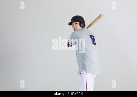 joueur de sports de baseball, homme coréen asiatique avec chauve-souris Banque D'Images