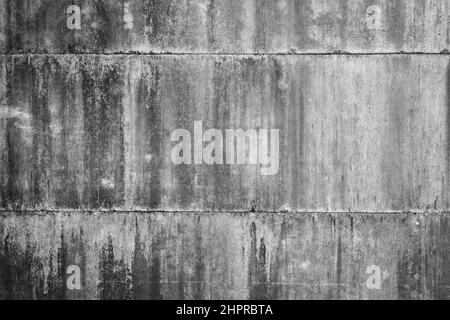 Ancienne surface murale en ciment sale et texturée. Avec taches irrégulières et petits trous. Banque D'Images