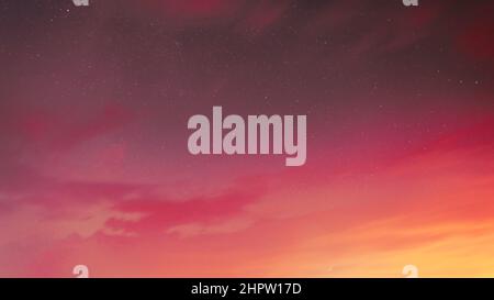 Couleur corail vivante. Soirée éclatante ciel lumineux fond naturel dans les couleurs jaune et rose. CopySpace. Étoiles de l'espace Starlight Starry ciel Banque D'Images