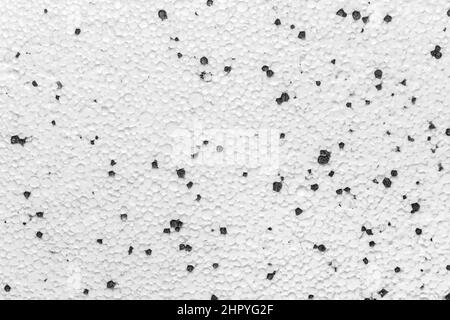 Polystyrène polystyrène plâtre mousse de plâtre pour murs secs matériau de construction surface blanche avec motif abstrait points Noir texture du mur arrière-plan. Banque D'Images