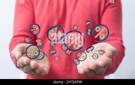 3d rendu des icônes de vente flottant dans la paume d'un homme Banque D'Images