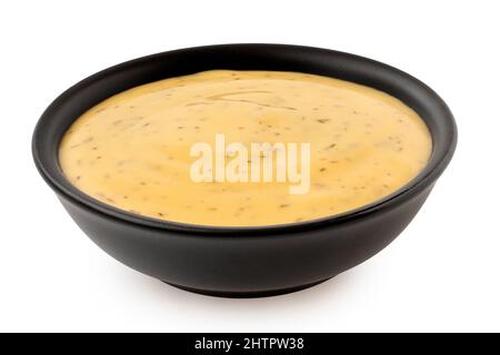 Sauce au miel et à la moutarde avec aneth dans un bol en céramique noire isolé sur blanc. Banque D'Images