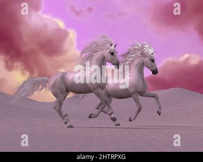 Desert Horse Fantasy - des nuages colorés entourent deux étalons blancs qui s'exécutent dans les dunes du désert. Banque D'Images
