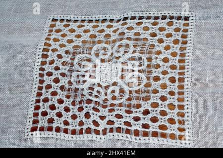 Broderie italienne artisanale close-uo Banque D'Images