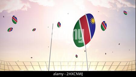 Image de ballons de rugby colorés avec le drapeau de la namibie au stade Banque D'Images