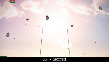 Image de ballons de rugby colorés avec le drapeau de la namibie au stade Banque D'Images