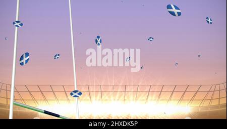 Image de ballons de rugby colorés avec le drapeau de l'écosse au stade Banque D'Images