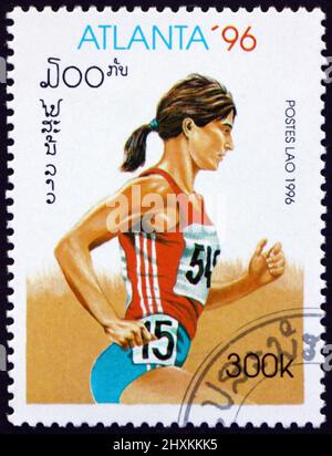 LAOS - VERS 1996: Un timbre imprimé au Laos montre en cours, Jeux olympiques d'été 1996, Atlanta, vers 1996 Banque D'Images