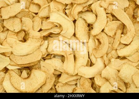 Fond de tranches de pomme séchées. Croustilles aux pommes. Texture saine des aliments. Banque D'Images