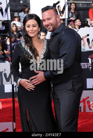 Jenni 'JWoww' Farley et Roger Matthews participant aux MTV Movie Awards 2014 à Los Angeles, Californie. Banque D'Images