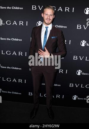 Alexander Ludwig assistant à l'ARRÊT BVLGARI et Save the Children. PENSEZ. DONNER. Pré-Oscar Party tenue à Spago à Beverly Hills, Californie. Banque D'Images