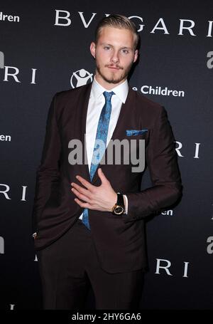 Alexander Ludwig assistant à l'ARRÊT BVLGARI et Save the Children. PENSEZ. DONNER. Pré-Oscar Party tenue à Spago à Beverly Hills, Californie. Banque D'Images