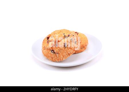 Biscuits aux canneberges sur fond blanc Banque D'Images