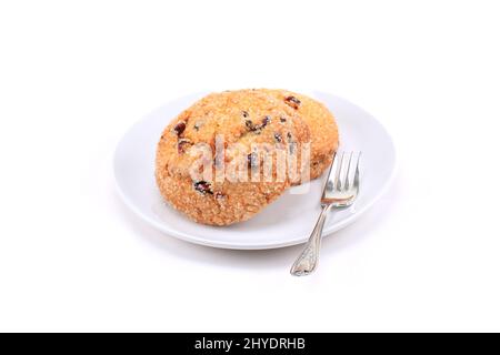 Biscuits aux canneberges sur fond blanc Banque D'Images