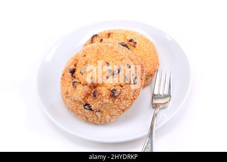 Biscuits aux canneberges sur fond blanc Banque D'Images
