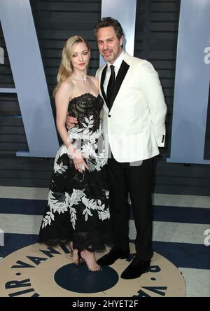 Amanda Seyfried et Thomas Sadoski participant à la Vanity Fair Oscar Party qui s'est tenue à Beverly Hills, Los Angeles, États-Unis Banque D'Images