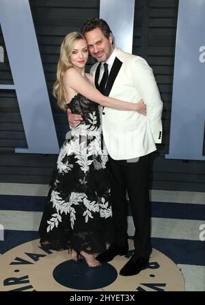 Amanda Seyfried et Thomas Sadoski participant à la Vanity Fair Oscar Party qui s'est tenue à Beverly Hills, Los Angeles, États-Unis Banque D'Images