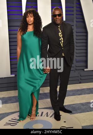 Idris Elba et Sabrina Dhowre participant à la Vanity Fair Oscar Party de 2019 qui s'est tenue au Wallis Annenberg Center for the Performing Arts à Beverly Hills, en Californie Banque D'Images