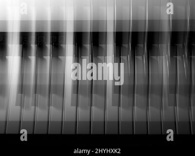 Photo d'art noir et blanc d'un clavier de musique en effervescence en arrière-plan abstrait Banque D'Images