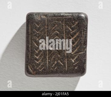 Cachet, Tabloïd. Ouest de l'Iran, vers 4th millénaire avant J.-C.. Outils et équipement; joints. Serpentin brun foncé Banque D'Images