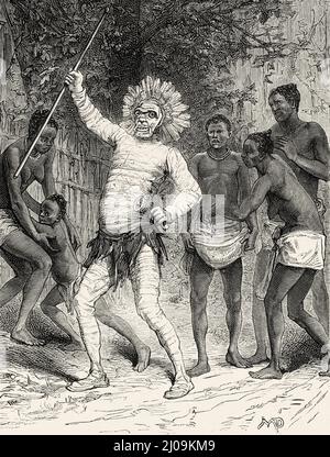 Shaman en masque rituel, Afrique centrale. Vieux 19th siècle illustration gravée de Voyage de Zanzibar à Benguela par Verney Lovett Cameron, le Tour du monde 1877 Banque D'Images