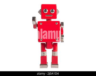 Photo isolée d'un vieux jouet robot de couleur rouge sur fond blanc. Banque D'Images