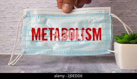 inscription métabolisme cubes en bois avec des lettres sur fond bleu. Banque D'Images