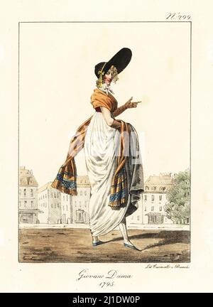 Femme à la mode ou Merveilleuse, époque révolutionnaire française, 1795. Elle porte une casquette de jockey avec un énorme pic, une robe en mousseline, un châle long, et des bas brodés. Jeune Dame. 1795.. Après Carle Vernet. Lithographie de couleur main par Lorenzo Bianchi et Domenico Cuciniello d'après Hippolyte Lecomte de Costuci civili e militari della monarchia francese dal 1200 al 1820, Naples, 1825. Édition italienne des costumes civils et militaires de Lecomte de la monarchie française de 1200 à 1820. Banque D'Images