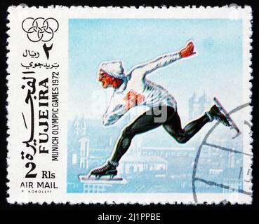 FUJEIRA - VERS 1972 : un timbre imprimé dans le Fujeira montre le patinage de vitesse, Jeux Olympiques d'été 1972, Munich, vers 1972 Banque D'Images