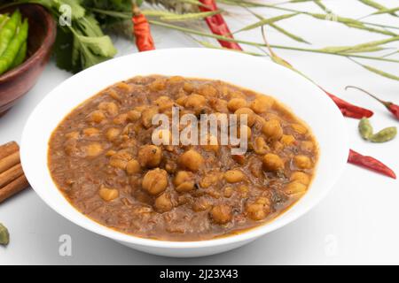 Punjabi Chhole également connu sous le nom de Chhola Masala Sabji Amritsari Chole Sabzi Masaledar Chana Chola ou pois chiches le curry à légumes est fait de pois chiches oignon Tomato Banque D'Images