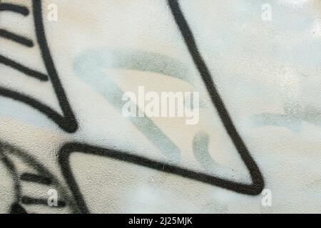 Blanc Gris Noir Graffiti mur en plâtre avec fragment urbain tendance Street Art abstrait Banque D'Images