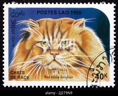 LAOS - VERS 1995: Un timbre imprimé au Laos montre le palangre rouge Tabby, chat domestique, vers 1995 Banque D'Images