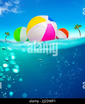 Ballons gonflables flottent dans l'eau sous l'image divisée Banque D'Images