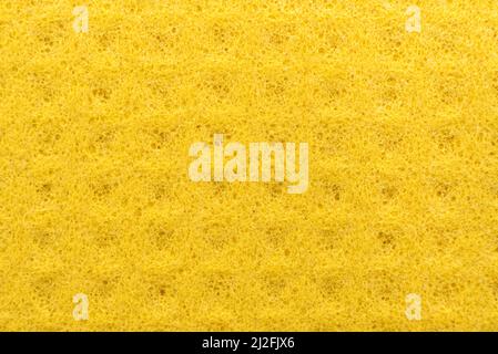 Arrière-plan des serviettes jaunes absorbantes. Matériau ou tissu poreux absorbant l'eau. Éponge Banque D'Images