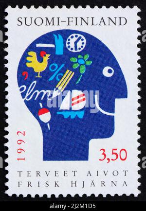 FINLANDE - VERS 1992 : un timbre imprimé en Finlande montre Man’s Head, Healthy Brain, vers 1992 Banque D'Images