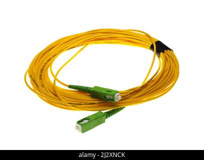 Câble de raccordement à fibre optique monomode SC-APC vers SC-APC pour systèmes FTTH Banque D'Images
